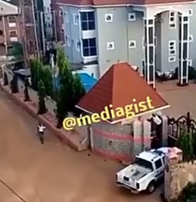 Watch the moment DPO jumped hotel fence after thugs stormed his police station (Video)